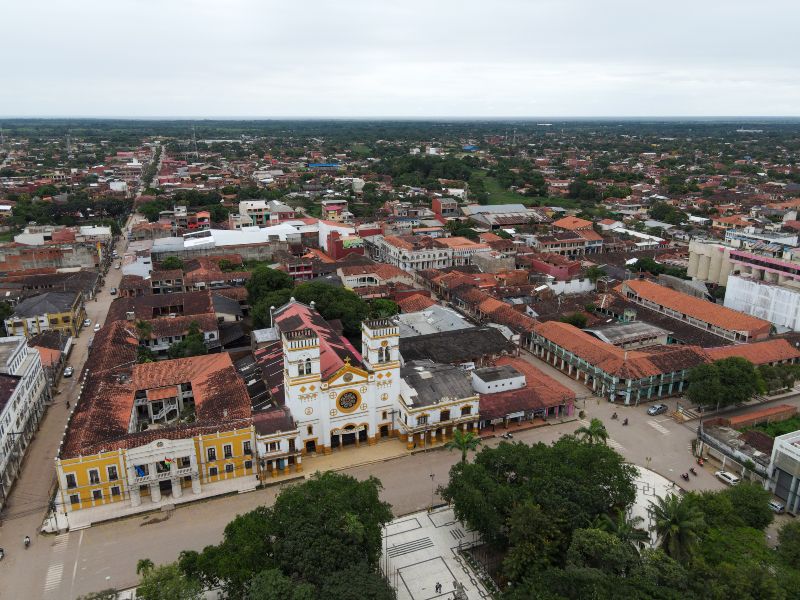 Aerial view of a town center with buildings and streets.