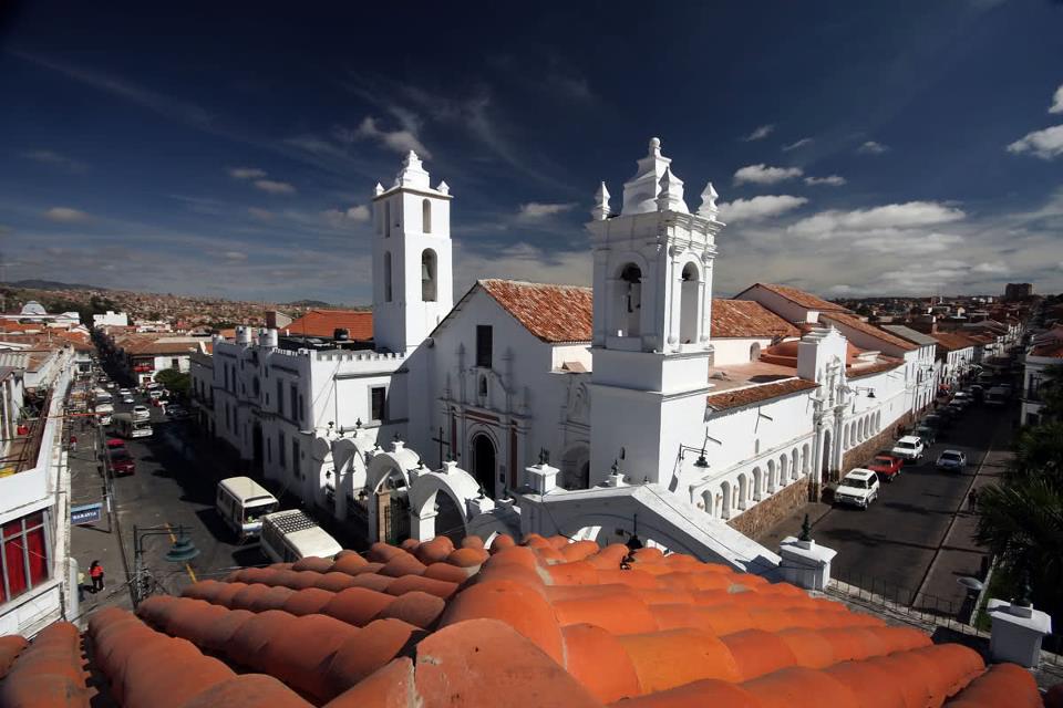 White church with terracotta roof.