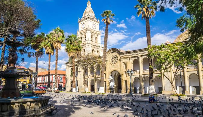 Plaza with cathedral and fountain.